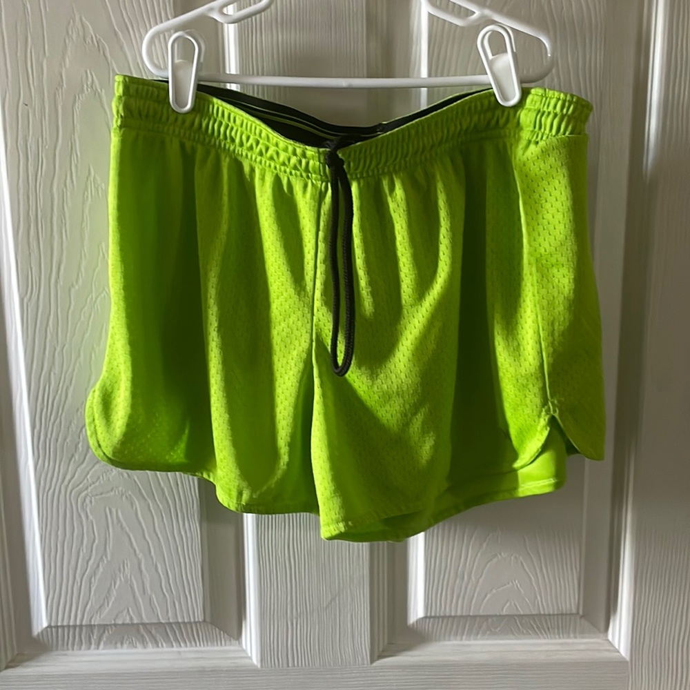 Green mesh athletic shorts